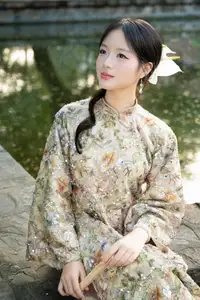 East Asian Traditional Beauty: Gentle Young Woman in Ao Dai with Elegant Wooden Fan - image 1