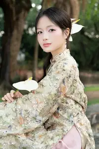 East Asian Traditional Beauty: Gentle Young Woman in Ao Dai with Elegant Wooden Fan - image 19