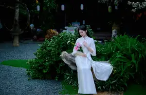 Graceful Vietnamese Woman in White Ao Dai with Lotus Flower in Serene Garden - image 6