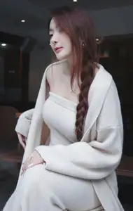 Discover the elegant charm of a gentle woman captured in a serene, thoughtful moment 176403855 - image 1