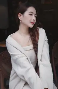 Discover the elegant charm of a gentle woman captured in a serene, thoughtful moment 176403855 - image 0