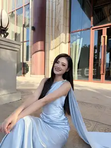 Miss Ý Nhi Radiates Elegance: A Vision in Her Sophisticated Evening Gown on Grand Ancient Stairs - image 3