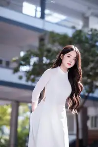 Discover the Grace of White Ao Dai: Vietnamese Girl's Delicate Beauty Shines - image 6