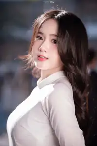 Discover the Grace of White Ao Dai: Vietnamese Girl's Delicate Beauty Shines - image 5