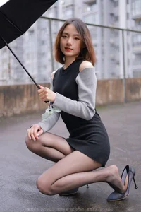 Xiaoliu in the Rain: Atmospheric IESS Photography Showcasing Elegant Black Silk Hosiery in a Moody Urban Setting - image 62