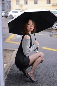 Xiaoliu in the Rain: Atmospheric IESS Photography Showcasing Elegant Black Silk Hosiery in a Moody Urban Setting - image 70
