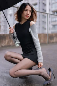 Xiaoliu in the Rain: Atmospheric IESS Photography Showcasing Elegant Black Silk Hosiery in a Moody Urban Setting - image 4