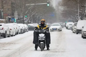 Resilience Amidst the Chill: Chinese Citizens Battle Record-Breaking Cold Wave - image 0