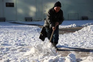 Resilience Amidst the Chill: Chinese Citizens Battle Record-Breaking Cold Wave - image 11