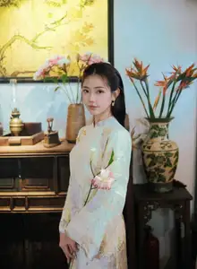 Captivating Asian Beauty: Elegant Woman Embracing Delicate Flowers - image 4
