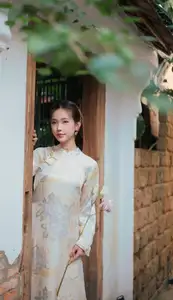 Captivating Asian Beauty: Elegant Woman Embracing Delicate Flowers - image 0
