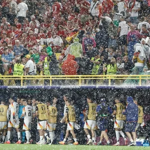 EURO 2024 Sideline Highlights: Danish Fans Brave the Rain and the Dortmund Stadium Waterfall - image 5