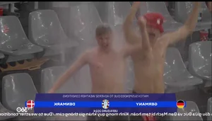 EURO 2024 Sideline Highlights: Danish Fans Brave the Rain and the Dortmund Stadium Waterfall - image 2
