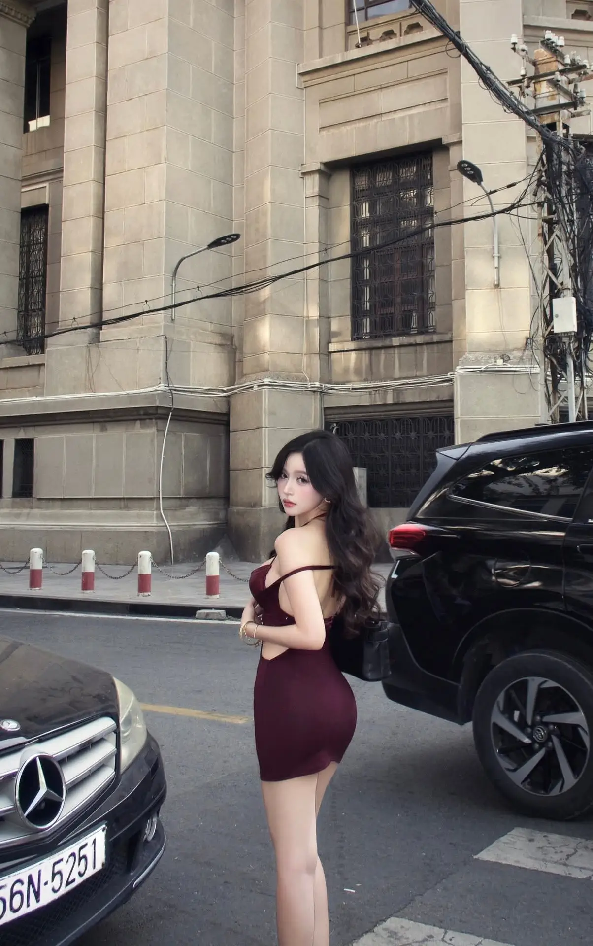 Charming Woman in Elegant Burgundy Mini Dress Defines Urban Street Style