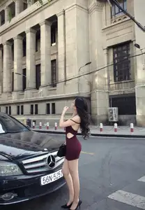Charming Woman in Elegant Burgundy Mini Dress Defines Urban Street Style - image 3