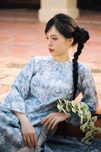 Timeless Grace in Blue Floral Ao Dai and Ancient Architecture - image 8