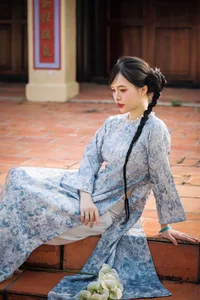 Timeless Grace in Blue Floral Ao Dai and Ancient Architecture - image 6