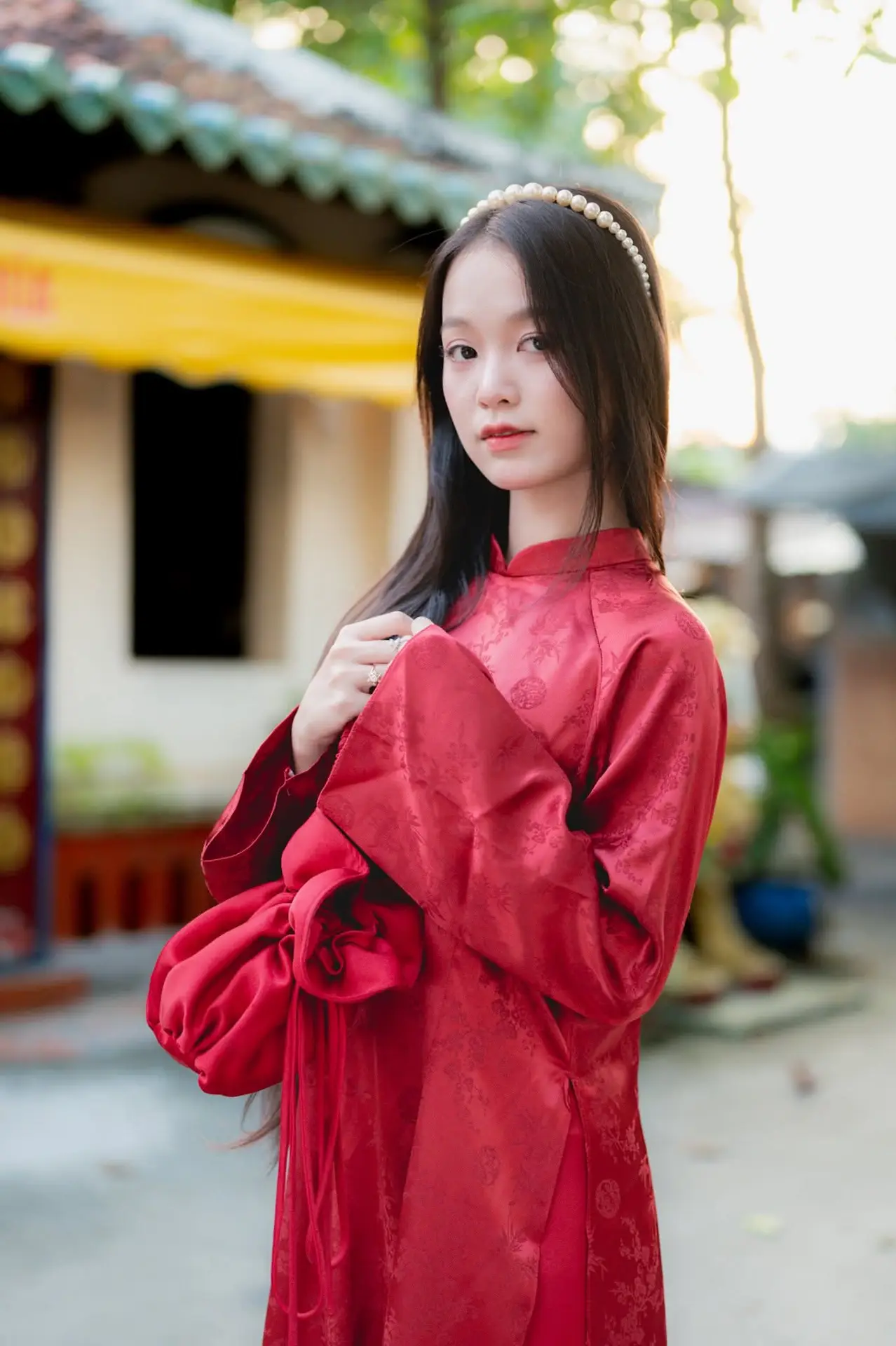 Elegant Vietnamese Beauty in Red Ao Dai: A Glimpse into Traditional Grace