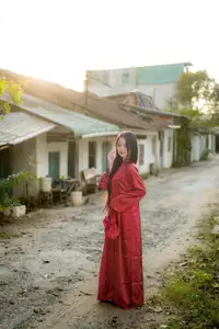 Elegant Vietnamese Beauty in Red Ao Dai: A Glimpse into Traditional Grace - image 9