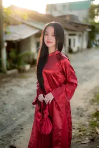 Elegant Vietnamese Beauty in Red Ao Dai: A Glimpse into Traditional Grace - image 3