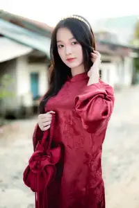 Elegant Vietnamese Beauty in Red Ao Dai: A Glimpse into Traditional Grace - image 2