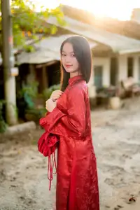 Elegant Vietnamese Beauty in Red Ao Dai: A Glimpse into Traditional Grace - image 5