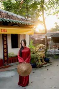 Elegant Vietnamese Beauty in Red Ao Dai: A Glimpse into Traditional Grace - image 1