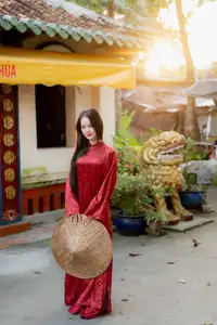 Elegant Vietnamese Beauty in Red Ao Dai: A Glimpse into Traditional Grace - image 4
