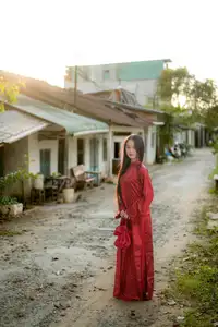 Elegant Vietnamese Beauty in Red Ao Dai: A Glimpse into Traditional Grace - image 11