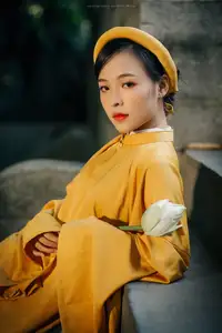Discover the Graceful Beauty of a Vietnamese Woman in Radiant Yellow Ao Dai with Pure Lotus 1000025235 - image 0