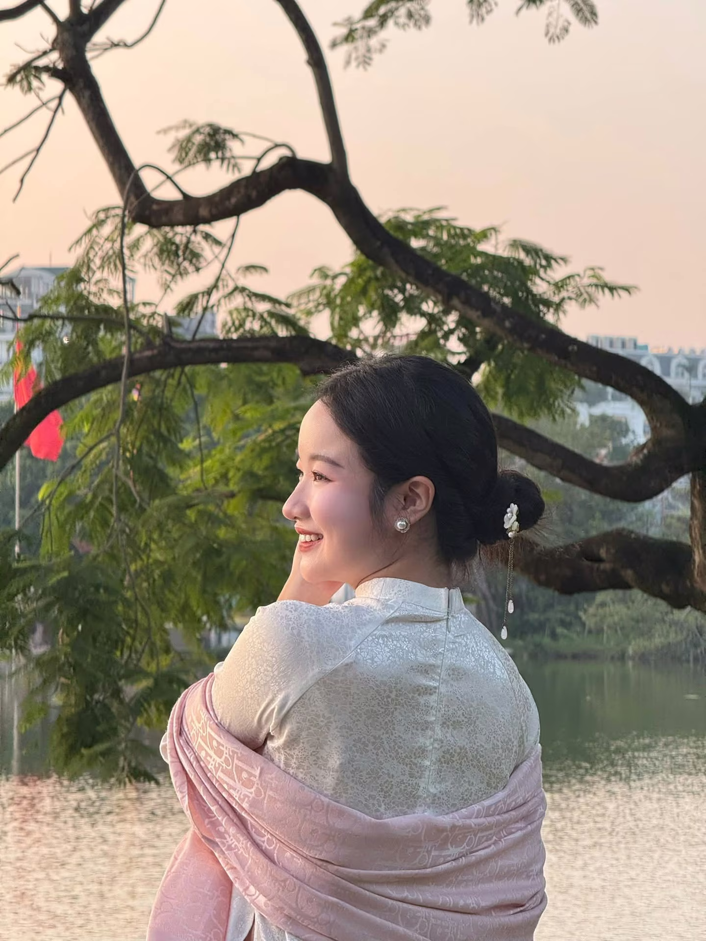 VGU No.148: Radiant Smile in Traditional Ao Dai: Elegant Vietnamese Beauty by the Lake.