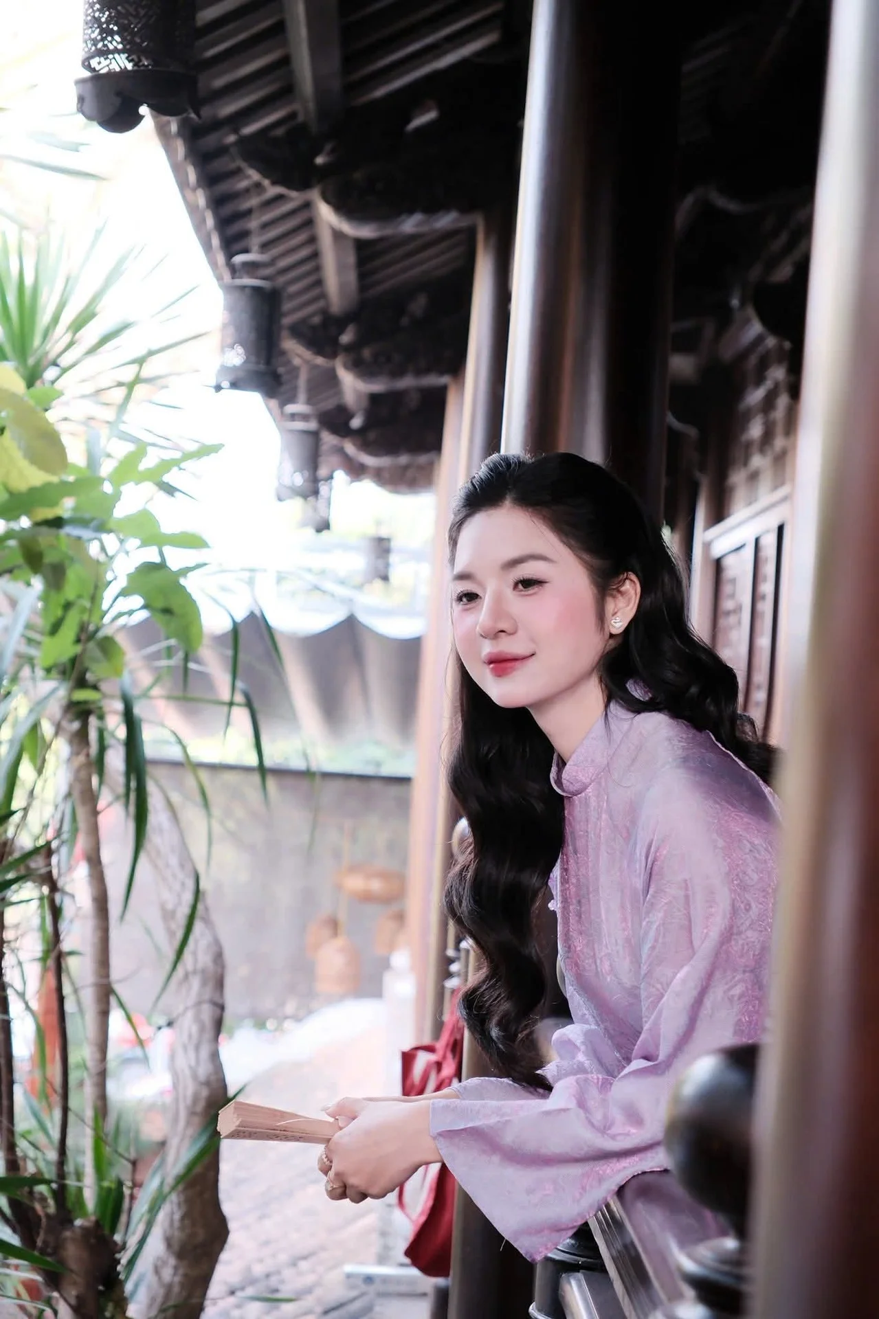 Ethereal Grace in Lavender Ao Dai Amidst Ancient Architecture