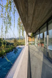 Dora Villa: Sustainable Raw Concrete Architecture Filled with Natural Light - image 3