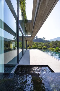 Dora Villa: Sustainable Raw Concrete Architecture Filled with Natural Light - image 24