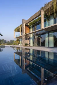 Dora Villa: Sustainable Raw Concrete Architecture Filled with Natural Light - image 2