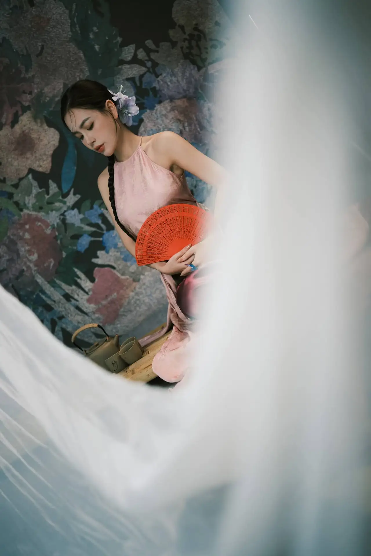 Discover Vietnamese Grace: An Elegant Girl in Ao Yem with a Red Fan.