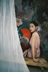Discover Vietnamese Grace: An Elegant Girl in Ao Yem with a Red Fan. - image 6