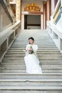 Serene Vietnamese Beauty: A Gentle Muse in White with Pink Lilies - image 8