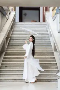 Serene Vietnamese Beauty: A Gentle Muse in White with Pink Lilies - image 3