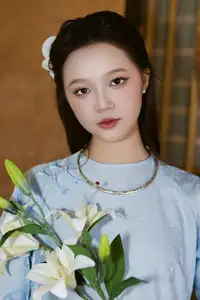 Serene Beauty: Graceful Young Woman in Traditional Attire with White Lilies - image 9