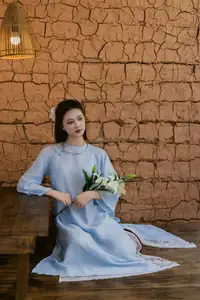 Serene Beauty: Graceful Young Woman in Traditional Attire with White Lilies - image 2