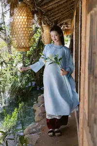 Serene Beauty: Graceful Young Woman in Traditional Attire with White Lilies - image 10