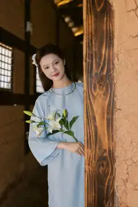 Serene Beauty: Graceful Young Woman in Traditional Attire with White Lilies - image 6
