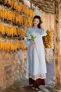 Serene Beauty: Graceful Young Woman in Traditional Attire with White Lilies - image 5