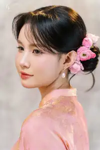 Elegant Asian Charm: Serene Young Woman in Traditional Pink Attire with Delicate Fresh Flowers - image 9