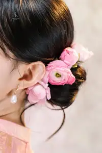 Elegant Asian Charm: Serene Young Woman in Traditional Pink Attire with Delicate Fresh Flowers - image 4