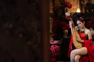 Alluring Asian Beauty with Pipa: Elegant in Traditional Red Attire - image 0
