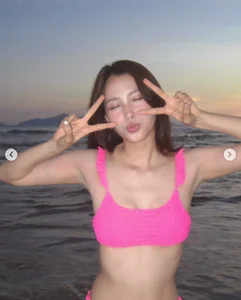 Miss Vietnam Tieu Vy Stuns in Vibrant Pink Swimwear During Beach Getaway - image 3