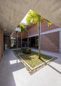 Hidden Oasis: The L-Shaped House in Tam Ky That Defies Narrow Alley Constraints - image 0