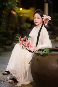Captivating Asian Beauty: Discover the Ethereal Charm of a Maiden in White with a Blossom in Her Hair. - image 6